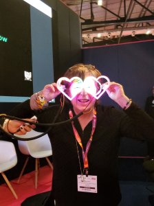 a woman wears fun giant glasses with integrated LED lights